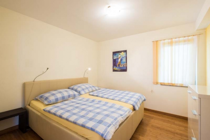 Schlafzimmer mit Doppelbett Apartment 1